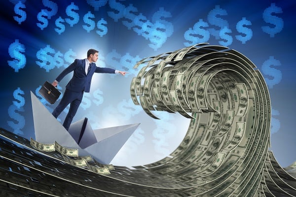 Man floating of wave of money 600 x 400